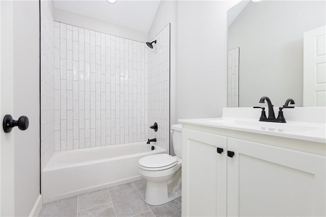 full bathroom with toilet, vaulted ceiling, tile patterned floors, tiled shower / bath combo, and vanity