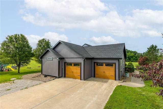 view of front of property with a front yard and a garage