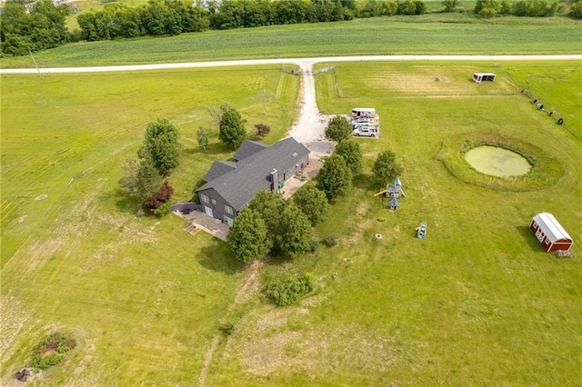 birds eye view of property featuring a rural view