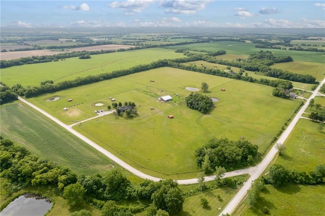 birds eye view of property with a rural view