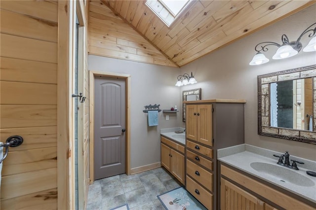 bathroom featuring lofted ceiling with skylight, vanity, and wooden ceiling