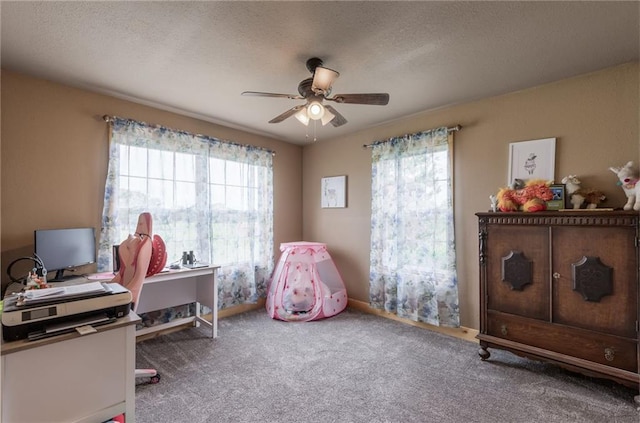 interior space featuring carpet flooring, ceiling fan, and a textured ceiling