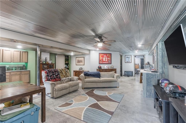 living room featuring ceiling fan and wood ceiling