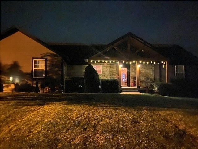 view of front of house with a yard