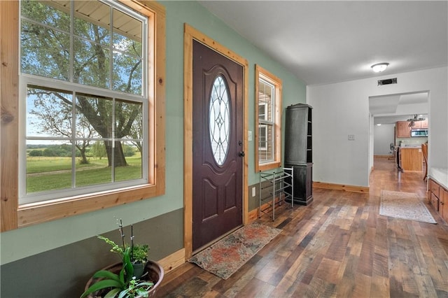 entrance foyer with dark hardwood / wood-style flooring