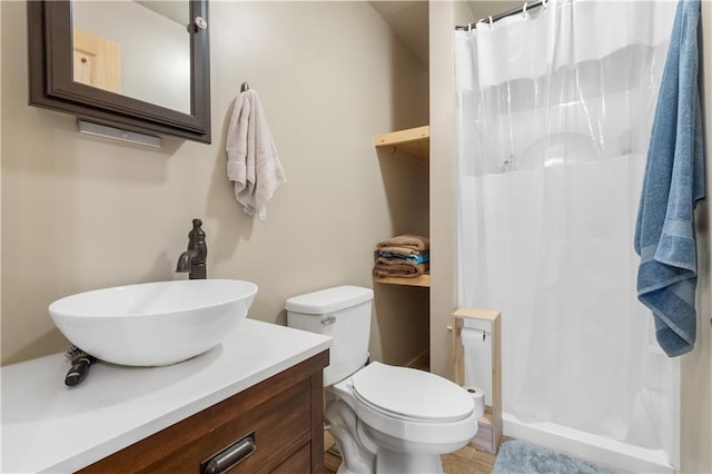 bathroom with vanity, toilet, and a shower with shower curtain