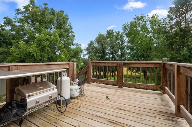 wooden terrace featuring area for grilling