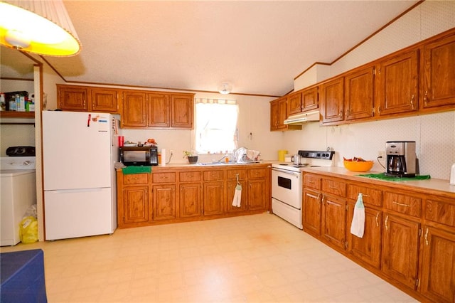 kitchen featuring white appliances, light tile flooring, and washer / clothes dryer