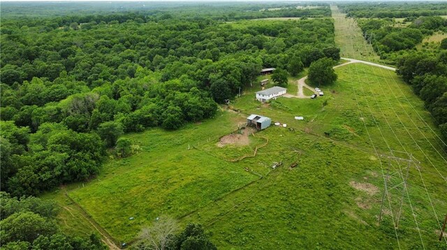 birds eye view of property with a rural view