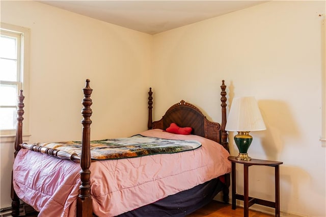 bedroom with hardwood / wood-style floors