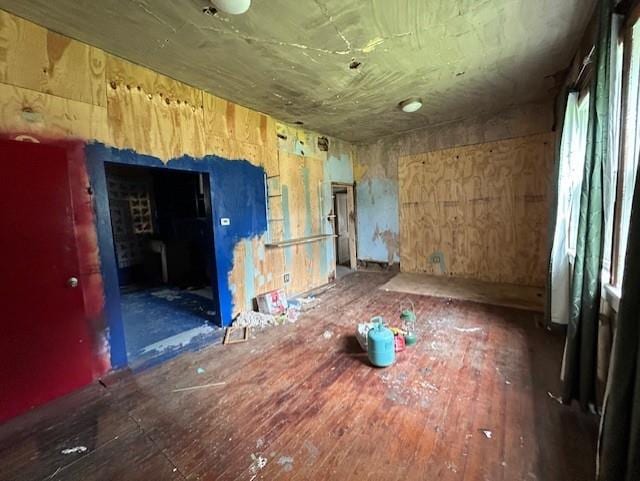 miscellaneous room featuring dark wood-type flooring