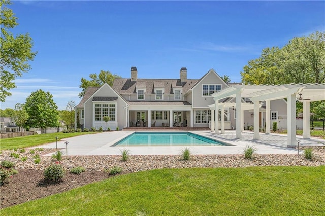 3116 W 86th St, Leawood, KS 66206 - rear view of property with a fenced in pool, a pergola, a yard, and a patio area