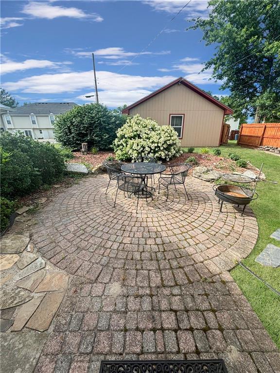 view of patio featuring an outdoor fire pit