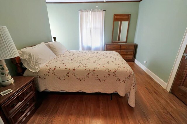 bedroom featuring dark wood-type flooring