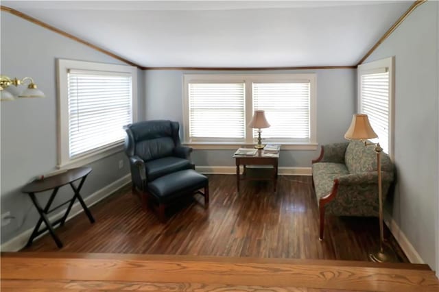 living area with lofted ceiling, wood finished floors, and crown molding