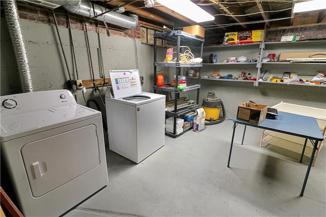 clothes washing area featuring washing machine and clothes dryer