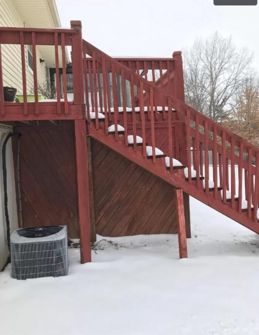 snow covered gate with central air condition unit