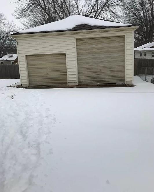 view of snow covered garage