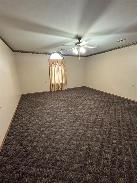 carpeted empty room with ceiling fan