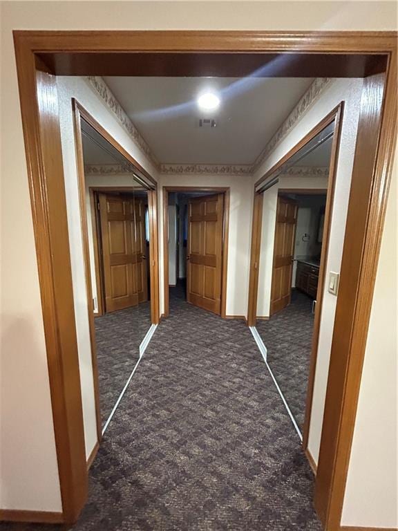 hall with dark carpet