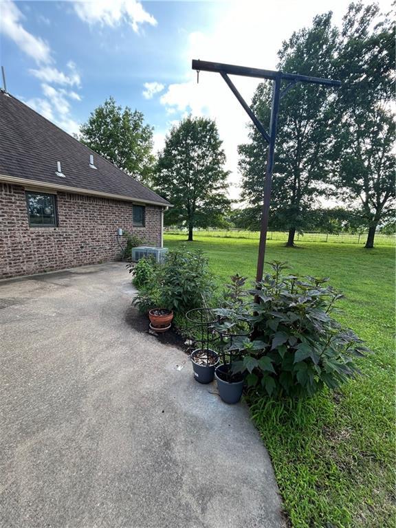 view of yard with a patio and cooling unit