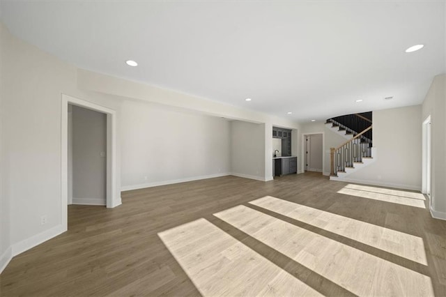 unfurnished living room featuring dark hardwood / wood-style flooring