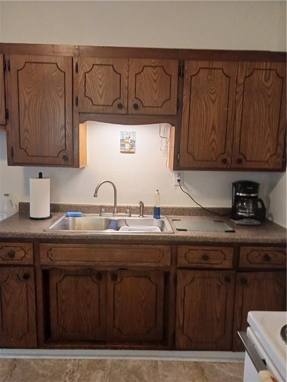 kitchen featuring sink and range