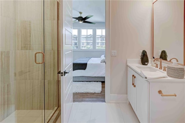 bathroom with walk in shower, tile patterned floors, vanity, and ceiling fan