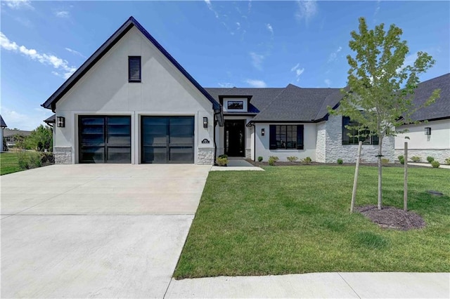 view of front of home with a garage and a front lawn