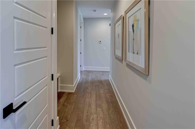 corridor featuring hardwood / wood-style floors