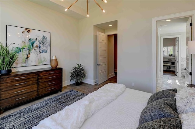 bedroom with hardwood / wood-style floors