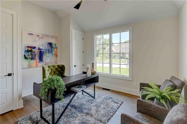 office featuring wood-type flooring, vaulted ceiling, and plenty of natural light