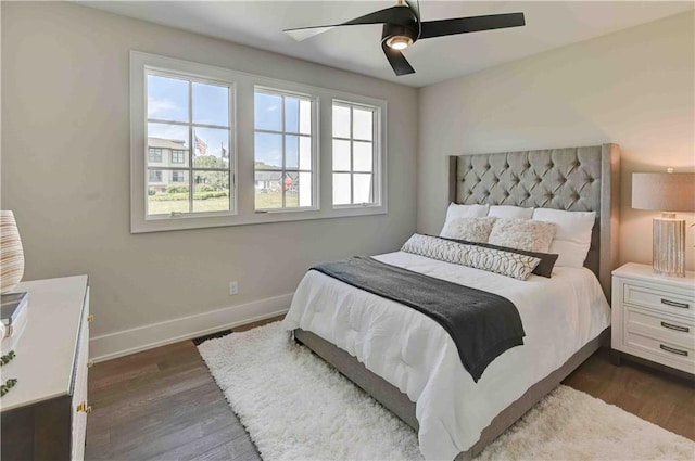 bedroom featuring dark hardwood / wood-style floors and ceiling fan