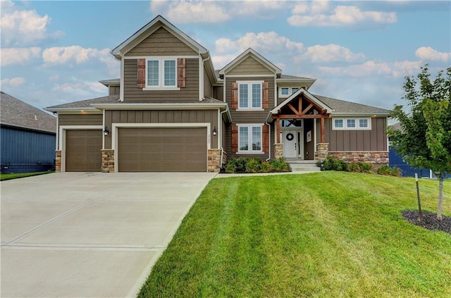 craftsman-style house featuring a garage and a front yard