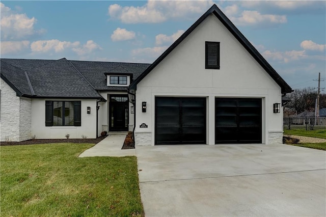 modern farmhouse style home featuring a front yard and a garage