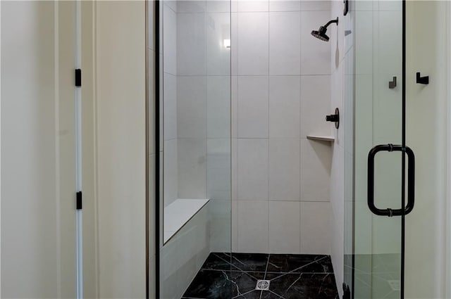 bathroom with a shower with shower door