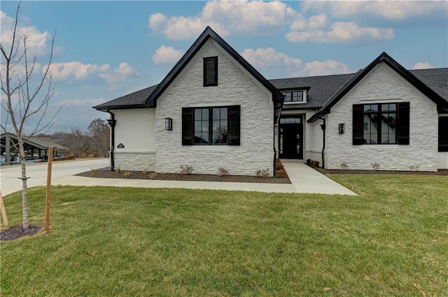 view of front of home with a front lawn