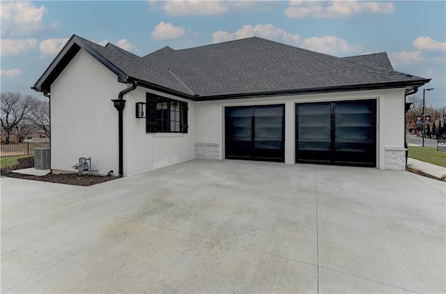 rear view of house with central air condition unit