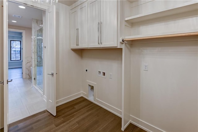 laundry room with washer hookup, dark wood-type flooring, cabinets, and hookup for an electric dryer