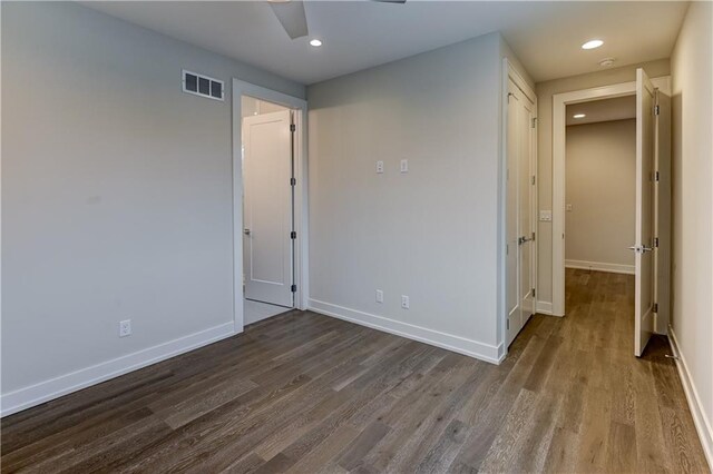 unfurnished bedroom featuring ceiling fan and wood-type flooring