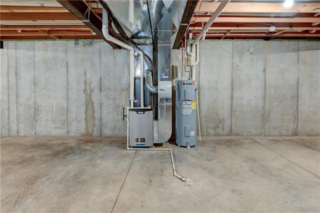 basement with electric water heater and heating unit