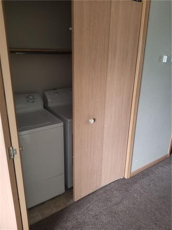 washroom with washing machine and dryer and light colored carpet