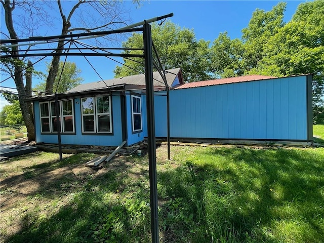 view of home's exterior featuring a lawn