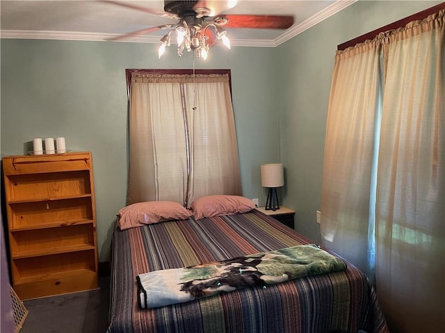 carpeted bedroom featuring ceiling fan and ornamental molding