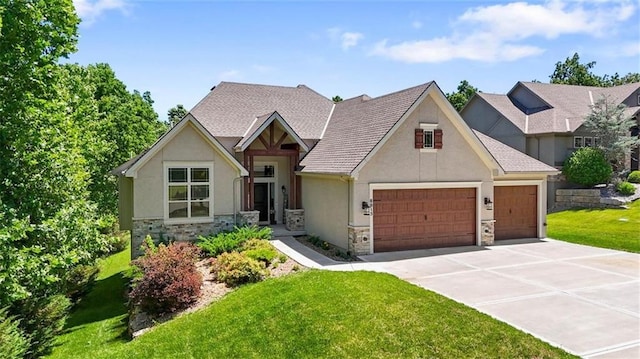 craftsman-style home with a garage and a front yard