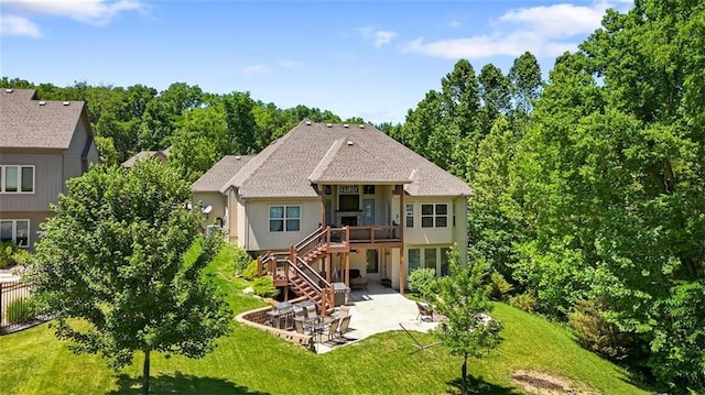 back of house with a yard, a patio, and a deck