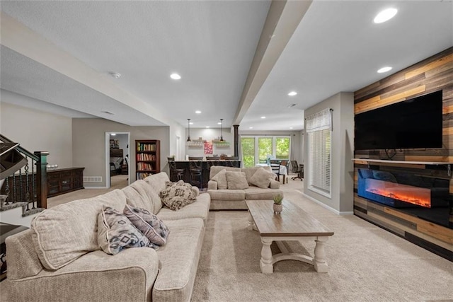 carpeted living room with bar area