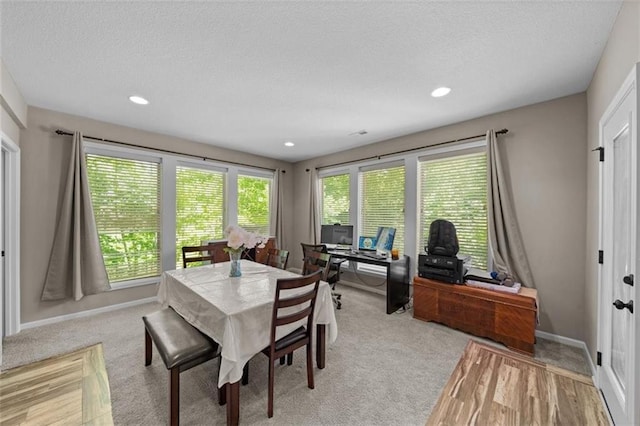 dining area with a textured ceiling