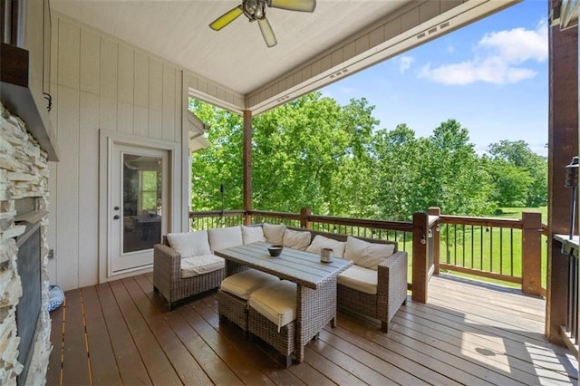 deck featuring an outdoor living space and ceiling fan