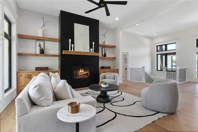 living room featuring light hardwood / wood-style floors and a healthy amount of sunlight